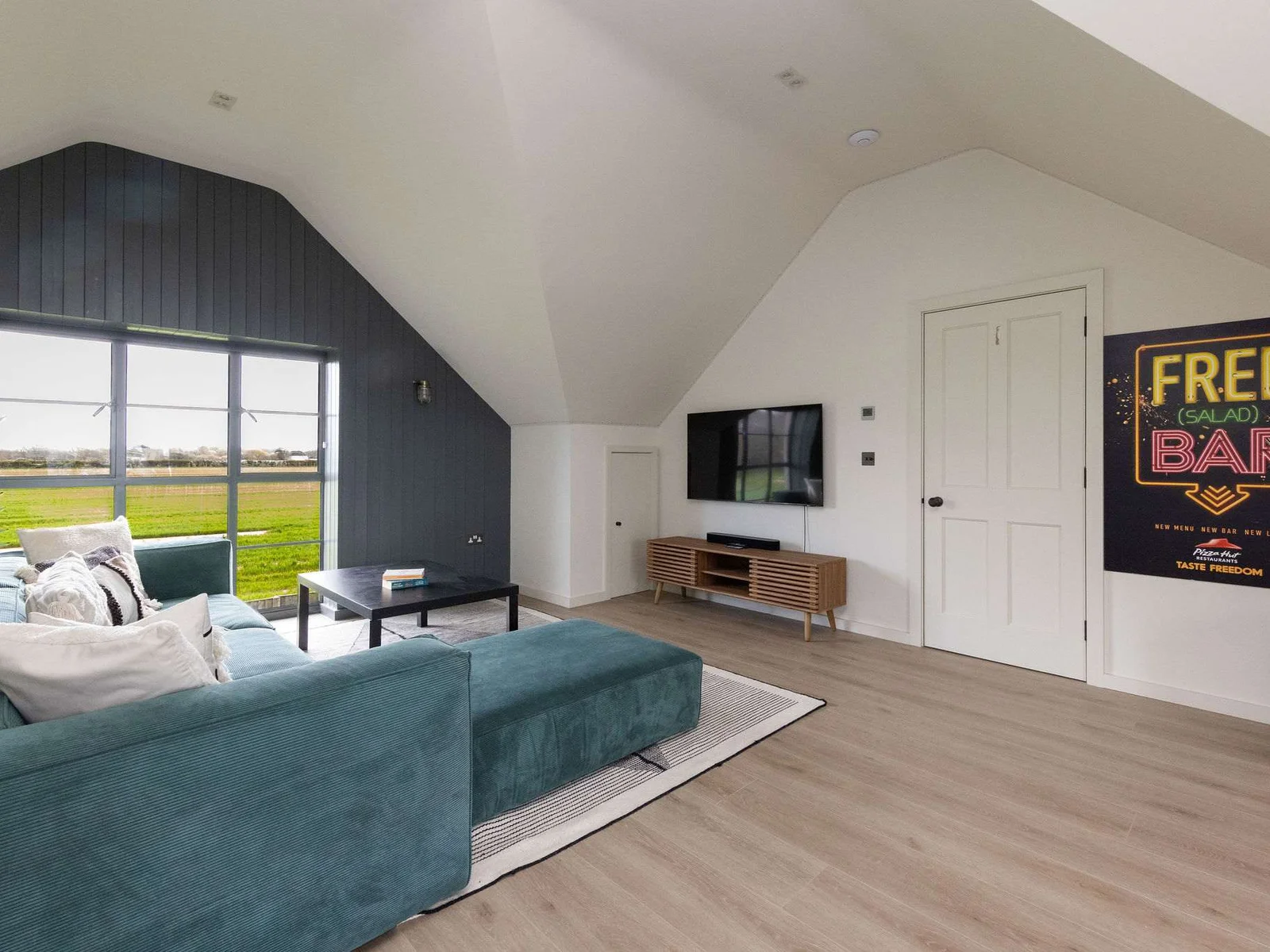 Chill-out zone with Smart TV, comfy sofas, and fun décor — a great space for all ages.