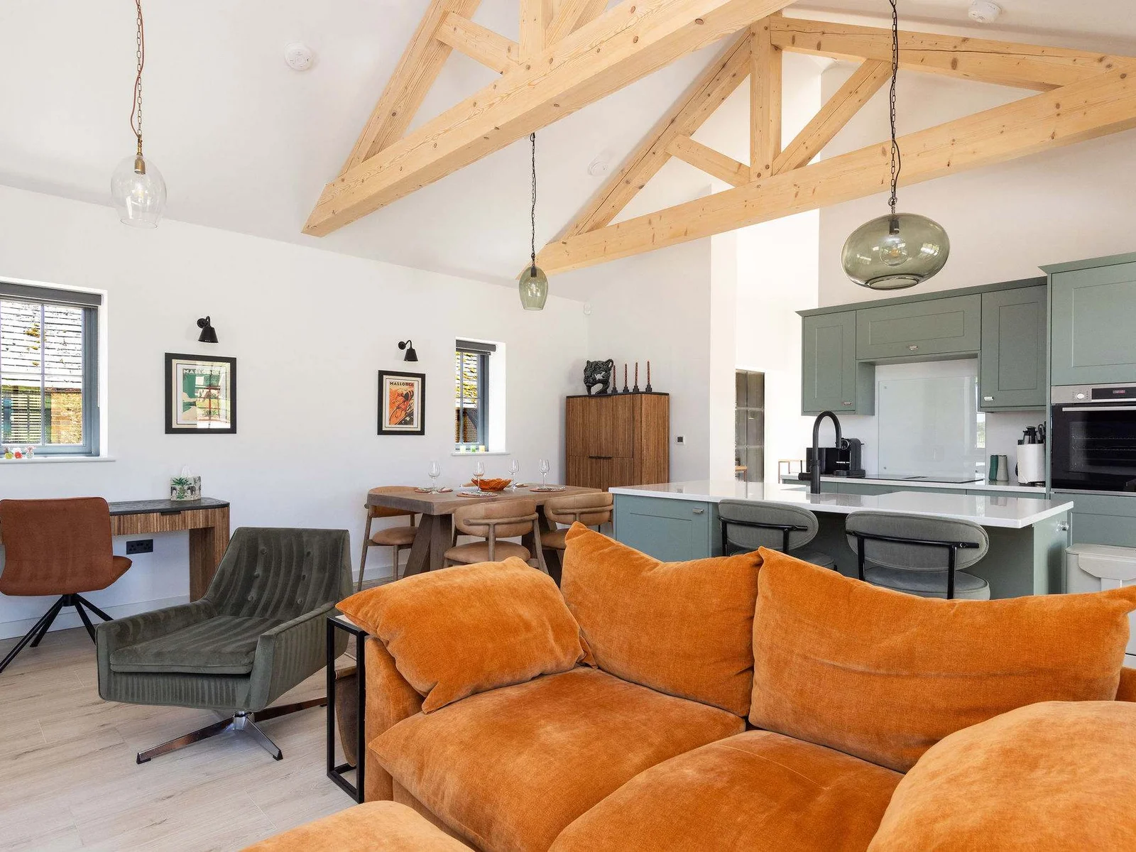 Relax in bright open-plan comfort, with cosy seating, vaulted beams, and space to unwind after Sussex adventures.
