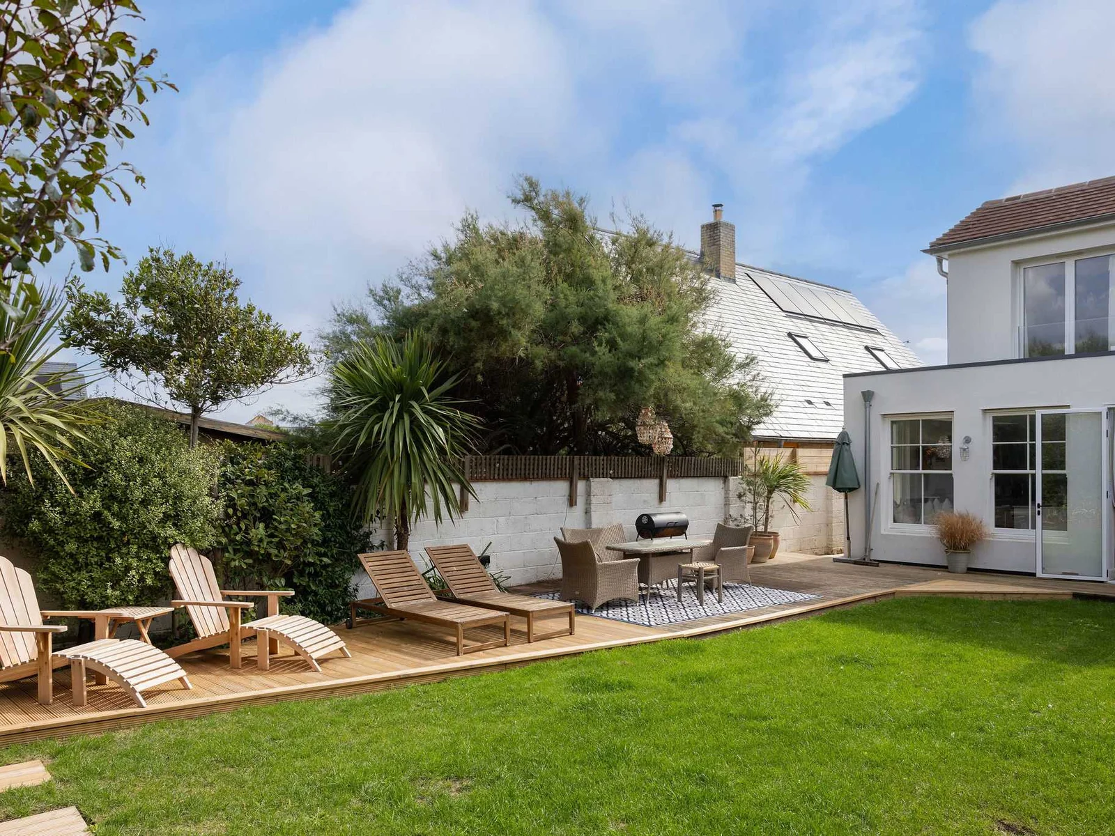 Unwind in the spacious garden with a cup of tea while the children play.