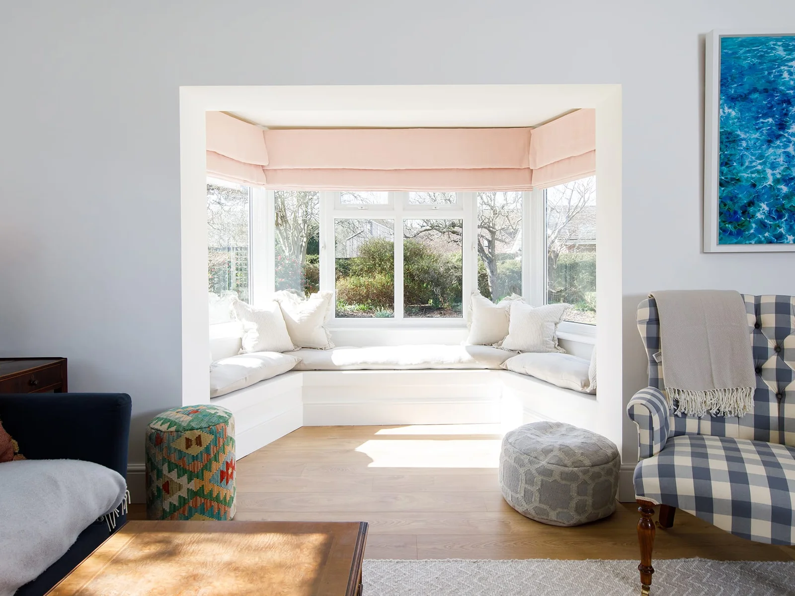 The lounge has a beautiful sunny window seat. The perfect spot to read a book or catch the morning sunshine with a cuppa.