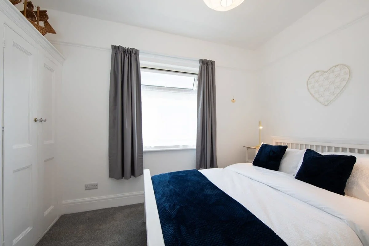 Bedroom three with a double bed and plenty of closet space for you to unpack