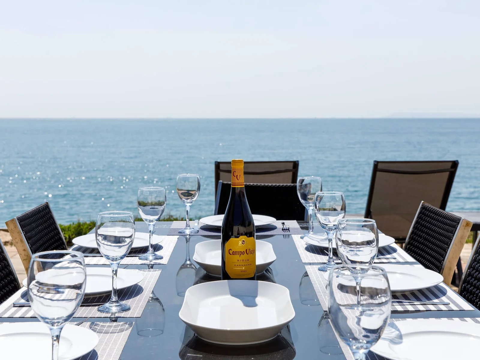 Dine to a back drop of sparkling sea and blue skies.