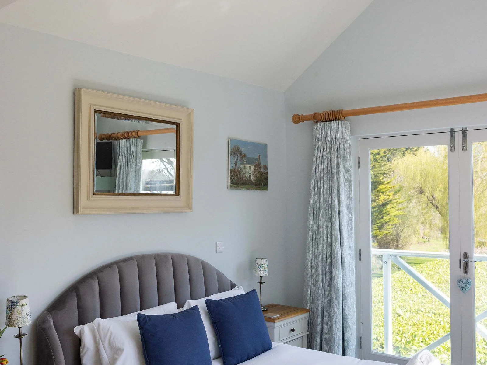 Bright master bedroom with Juliette balcony