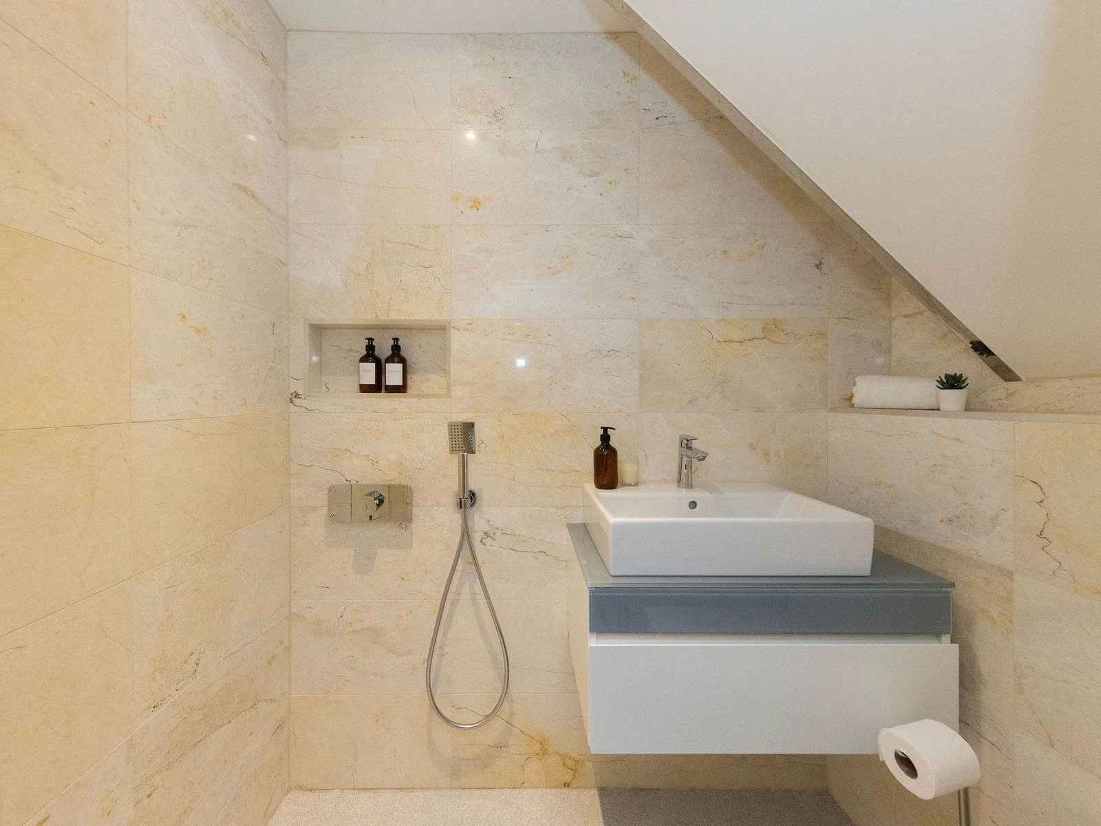 Bedroom 4- small en suite bathroom with shower, sink and wc!