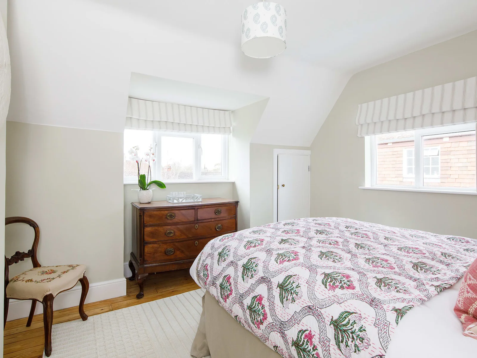 Bedroom 2 has a comfy king bed, chest of draws, bedside tables and two windows to let in plenty of natural light.