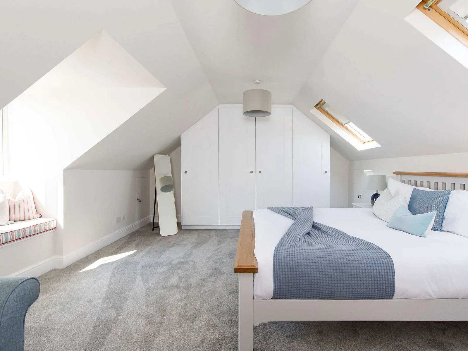 The second upstairs super king is light and bright, with soft blue furnishing.