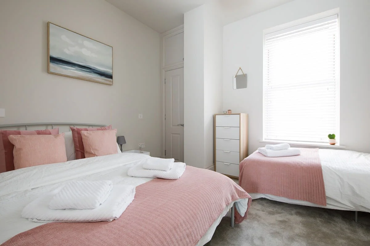 A view of both of the beds in the 2nd bedroom