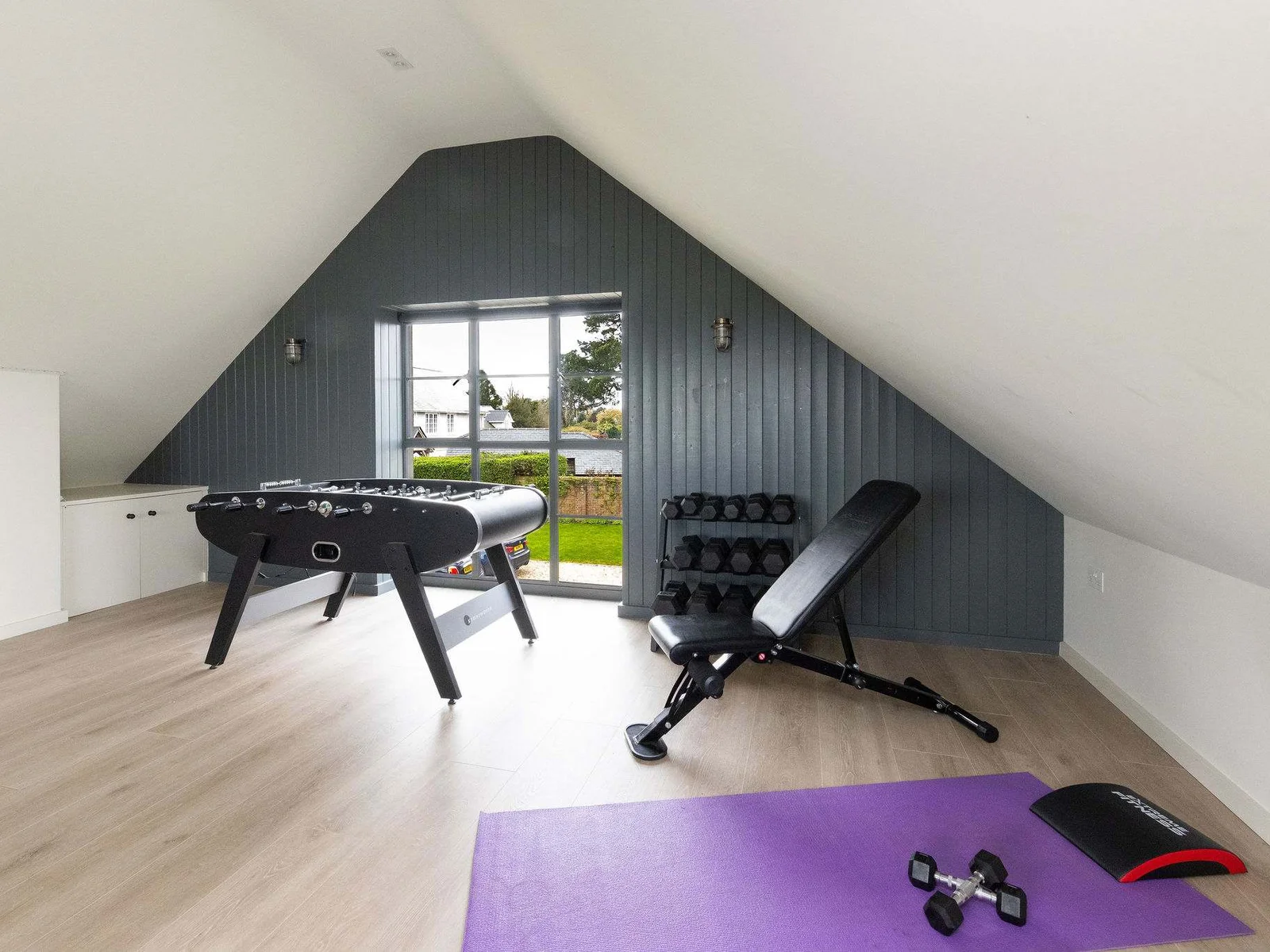 Stay active with gym equipment, foosball, and plenty of space for a workout session.