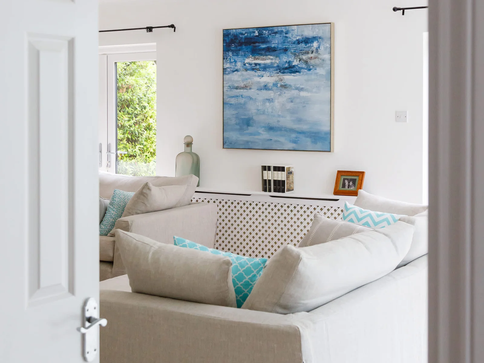 The living room features beautiful art work.