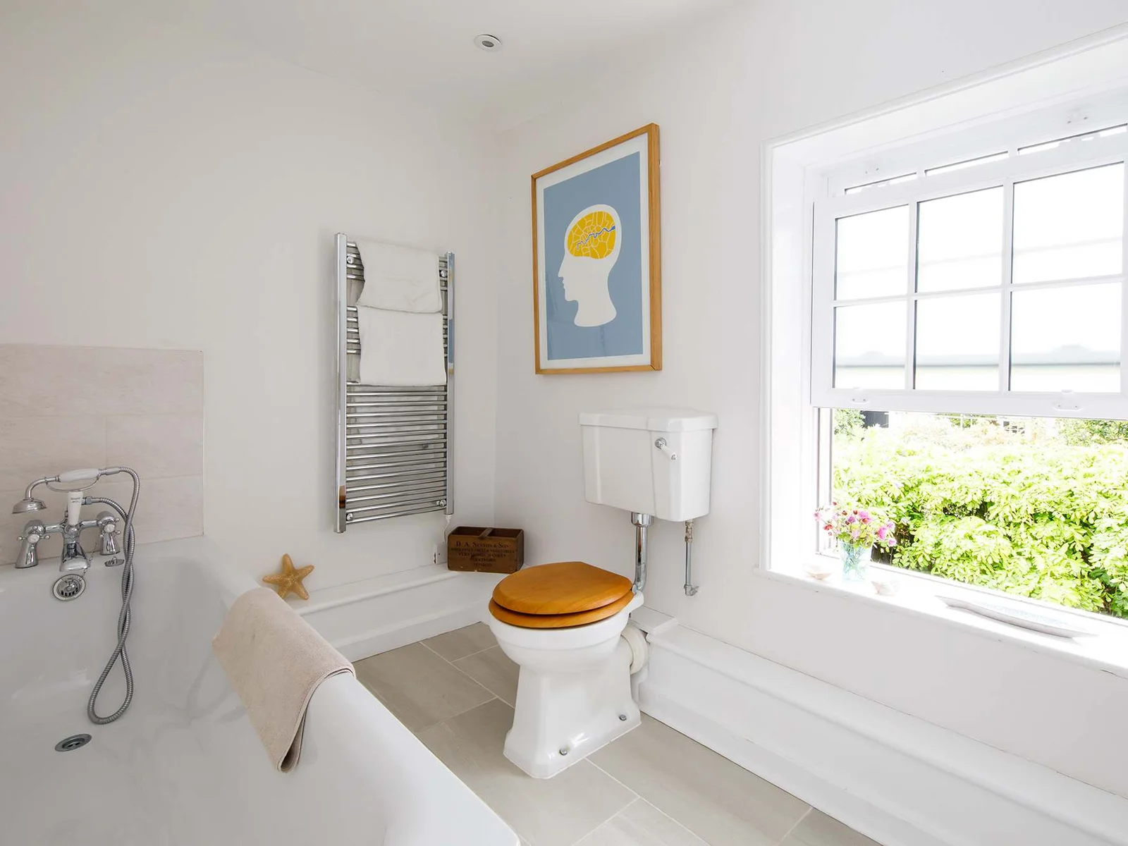 Two full bathrooms cater to four bedrooms