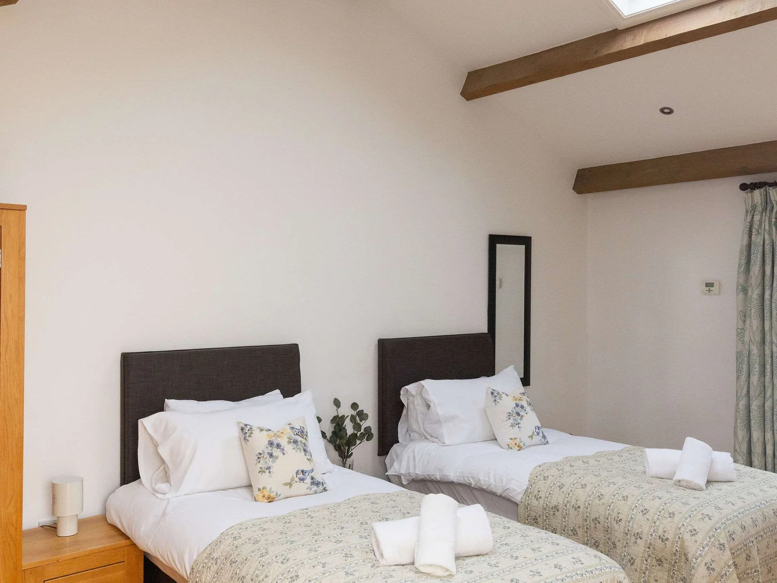 Vaulted ceilings and skylights give space and light to the room.