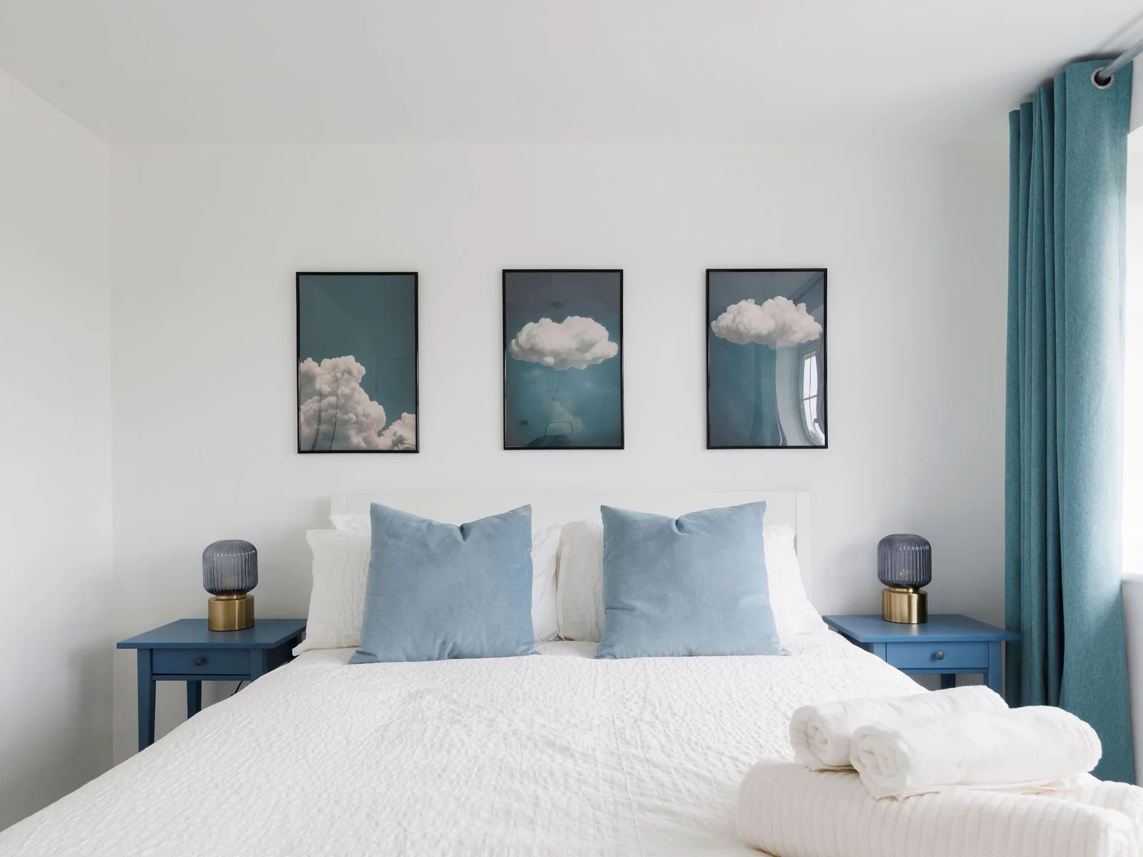 Elegant bedroom featuring blue curtains and matching decor for a cohesive look
