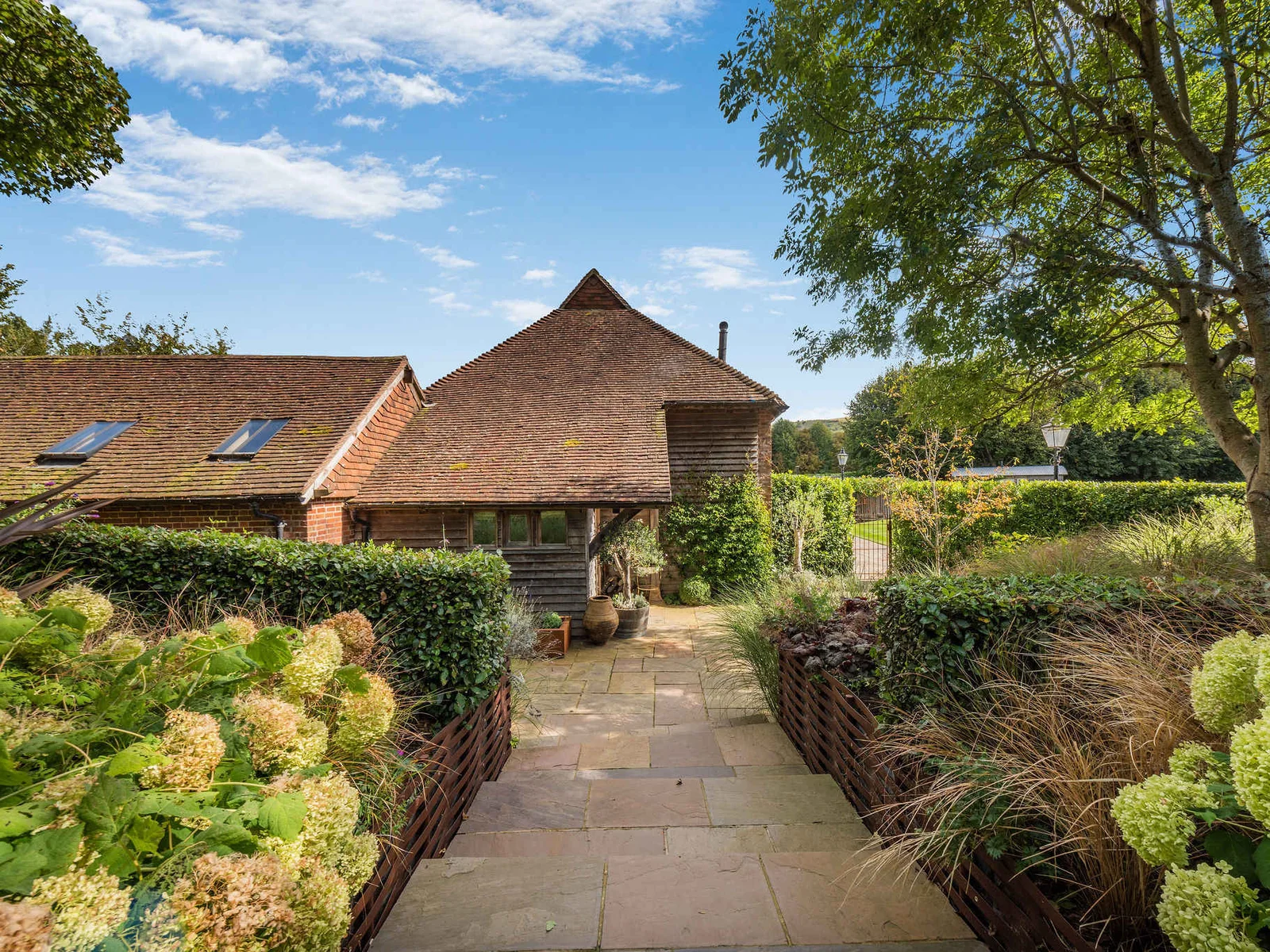 A peaceful garden approach through the beautifully landscaped grounds