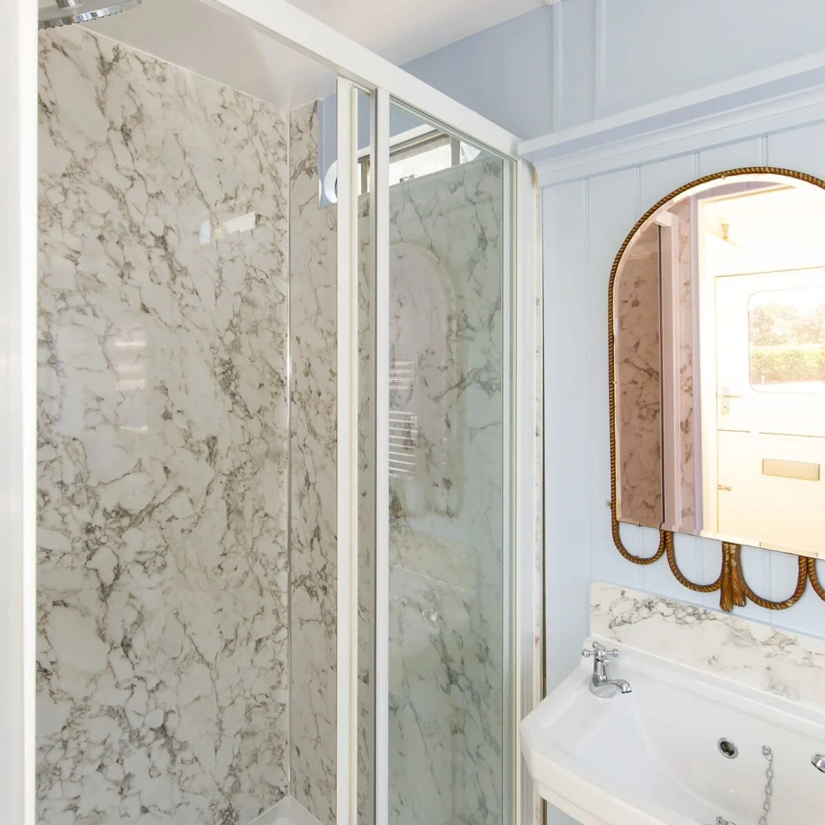 The shower is spacious and beautifully designed.