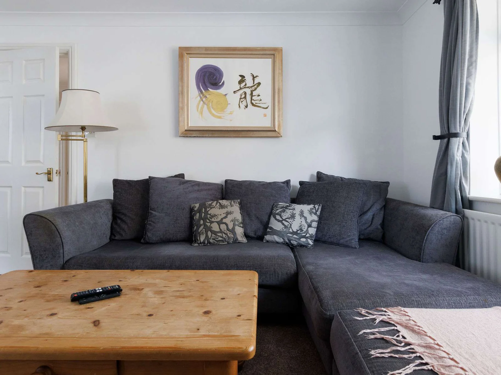 The large L-shaped sofa is the perfect spot to relax and unwind during the evenings.