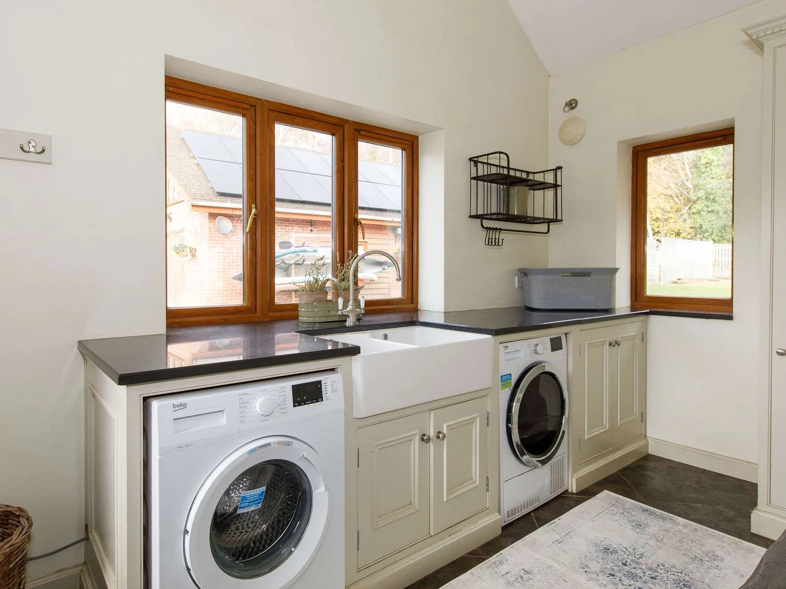 There is a downstairs utility room with all the essential appliances you need to keep on top of washing.