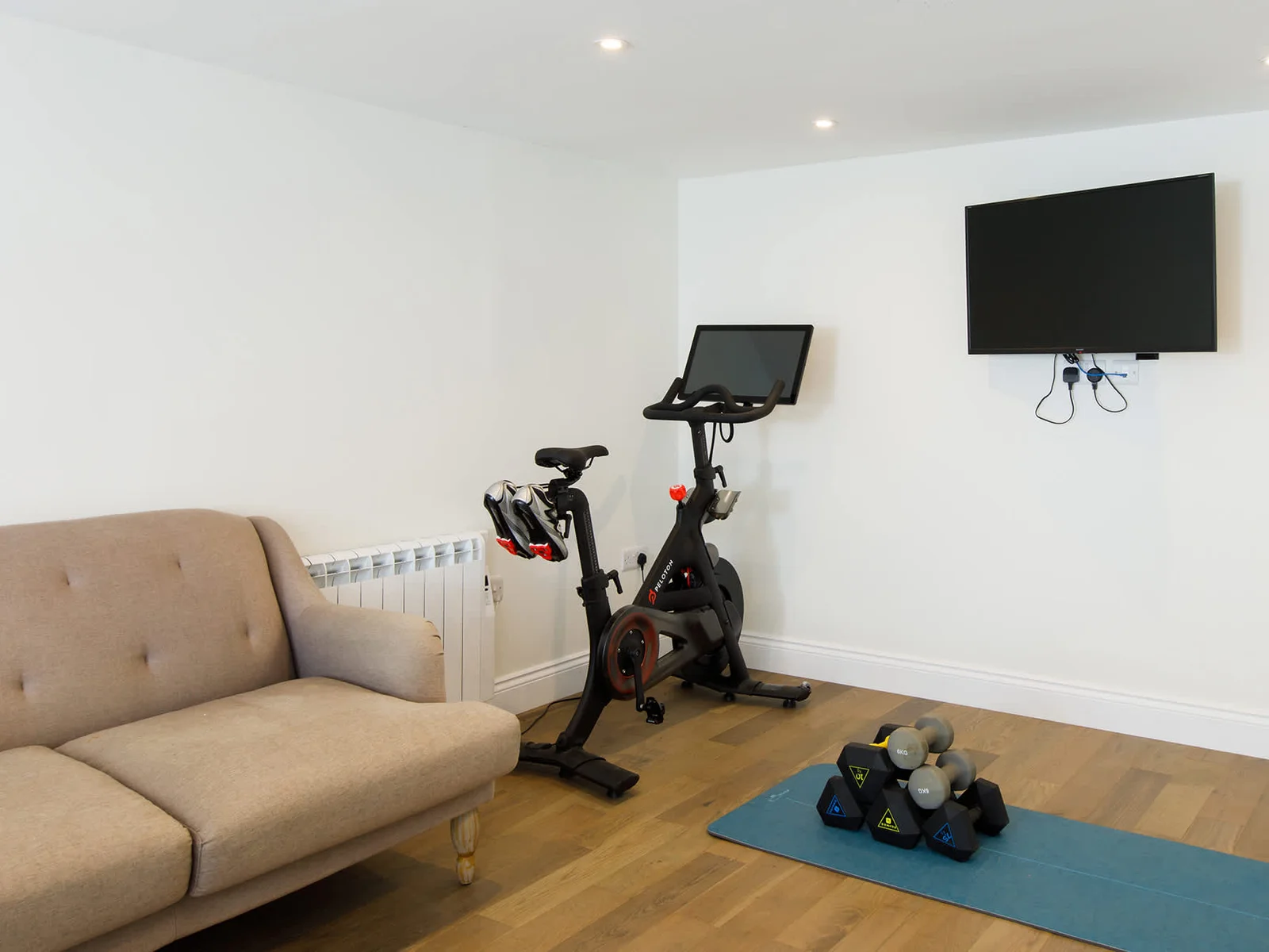 The games room also has a mini gym, with yoga mat, weights and Pelaton bike!