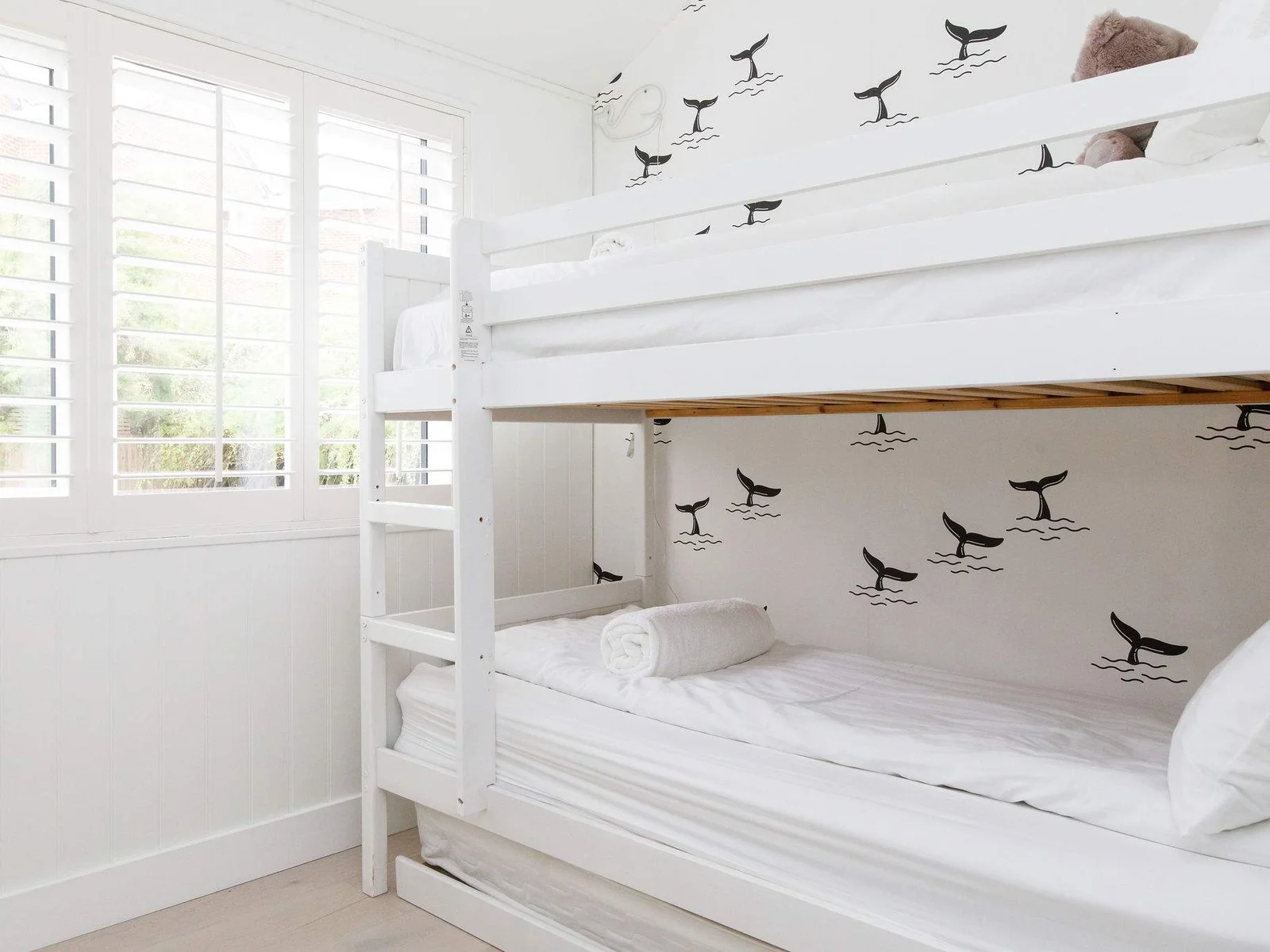 The bunkroom has a pull out trundle to sleep 3 children.