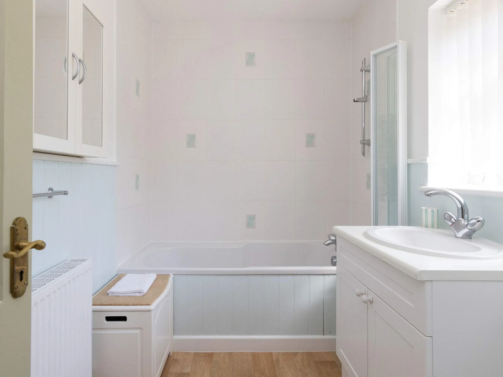 The ensuite has a bath, overbath shower, WC and sink.