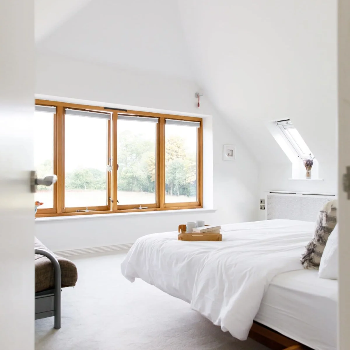 The impressive master bedroom has wonderful views of the lush green surroundings, a luxurious super king bed and grand ensuite.