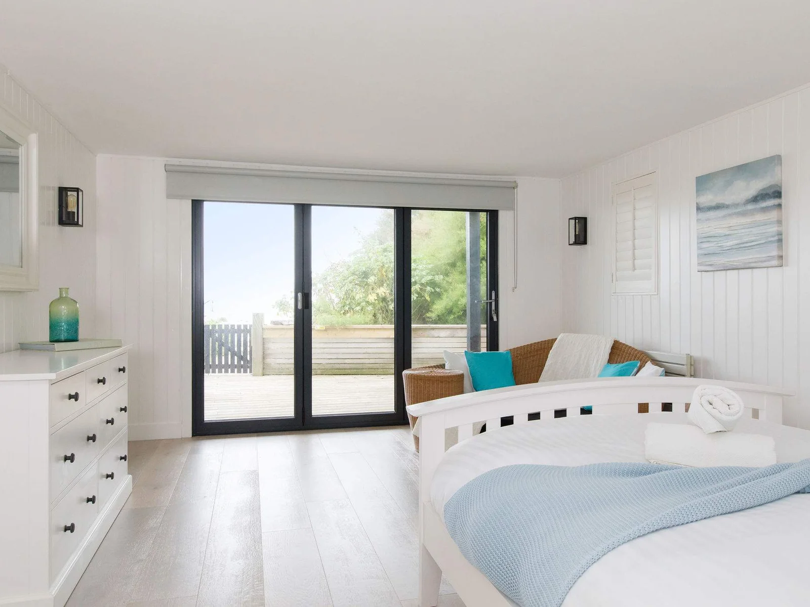 The king size bedroom with ensuite and dressing room is on the ground floor with direct access to the garden/beach.