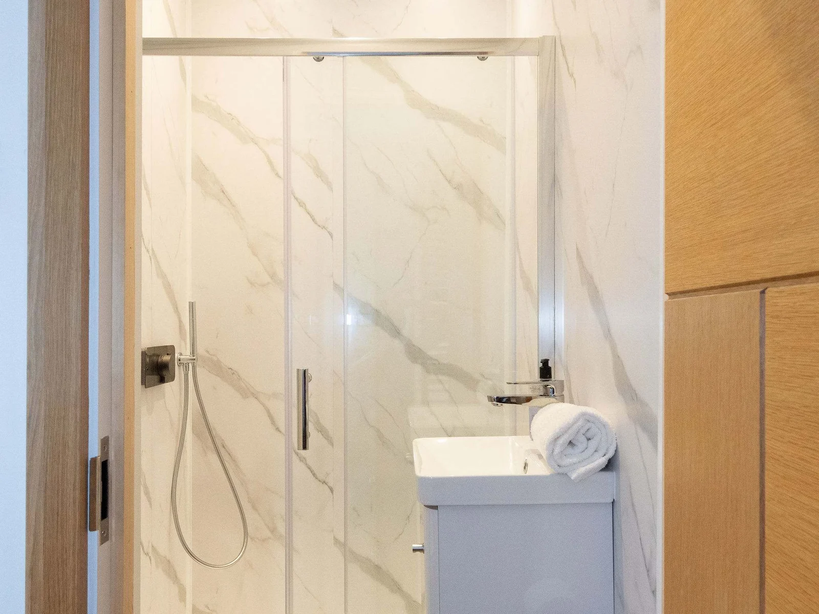 Bedroom 1- A compact shower, sink and wc accompany this bathroom!