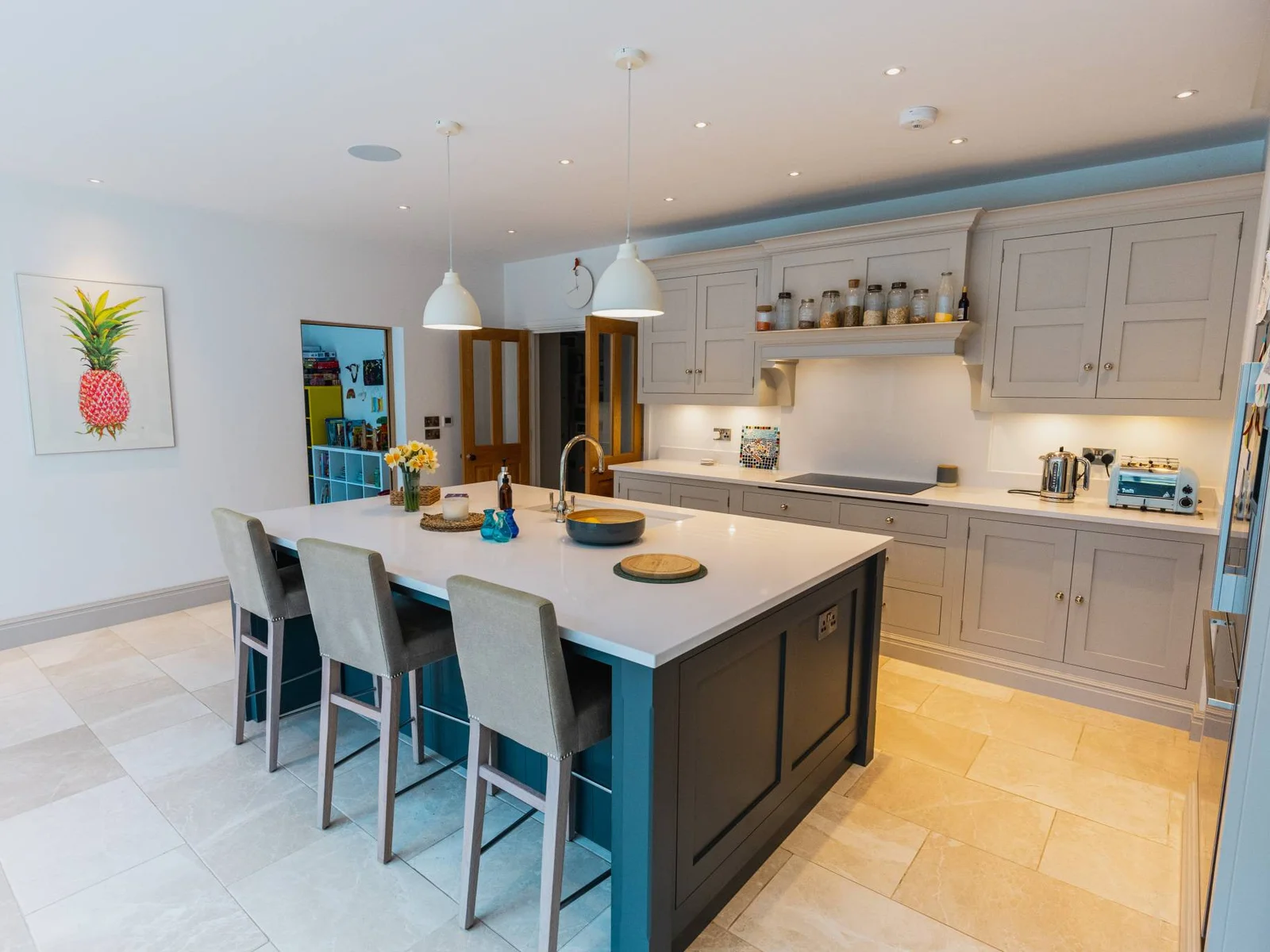 Spacious kitchen with central island seating, perfect for group breakfasts and relaxed dining.