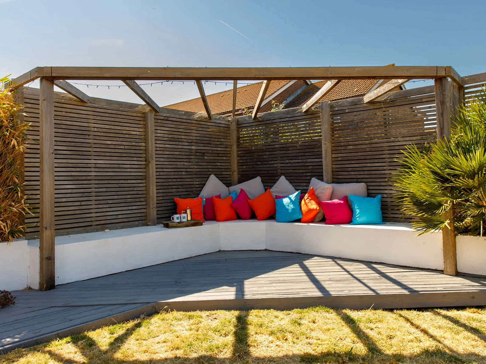 The in-built corner seating with decking is the perfect spot for a morning coffee or evening drink.