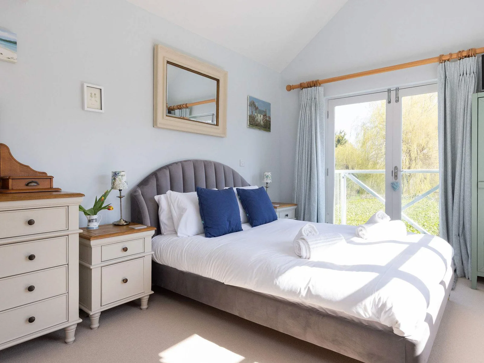 Light-filled bedroom with garden views