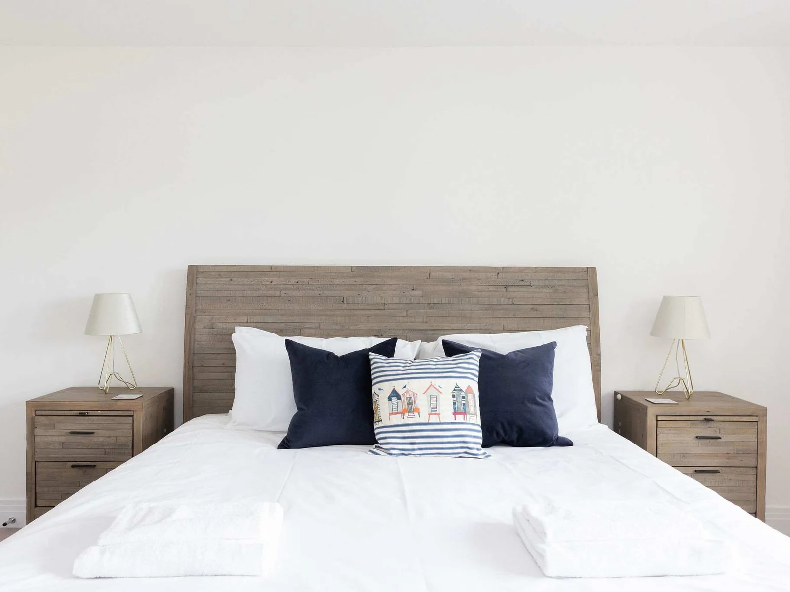 Sink into the comfortable king-size bed, complete with fresh linens and charming coastal details, for a perfect night's sleep.
