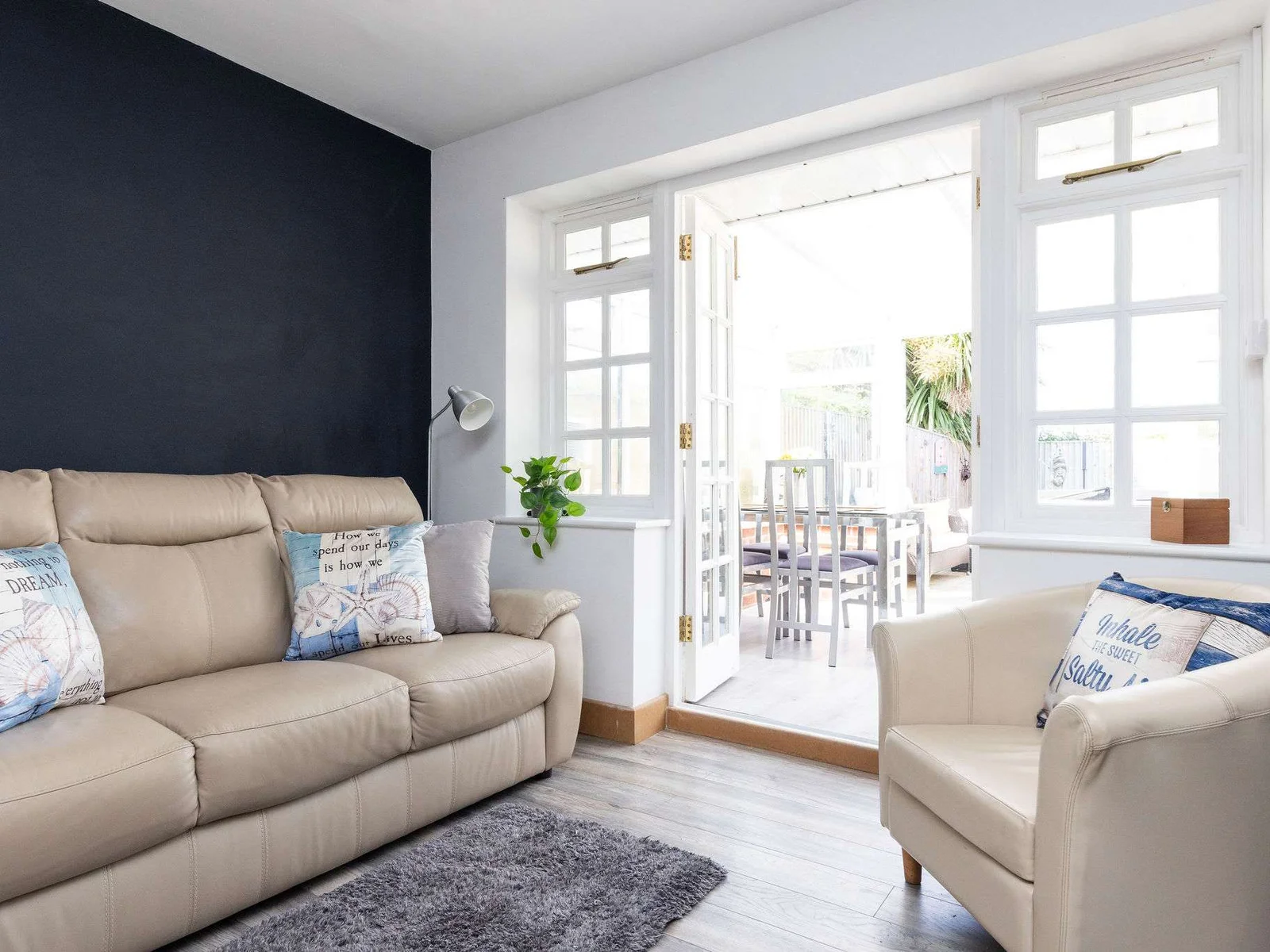 Comfy lounge with access to the conservatory and garden