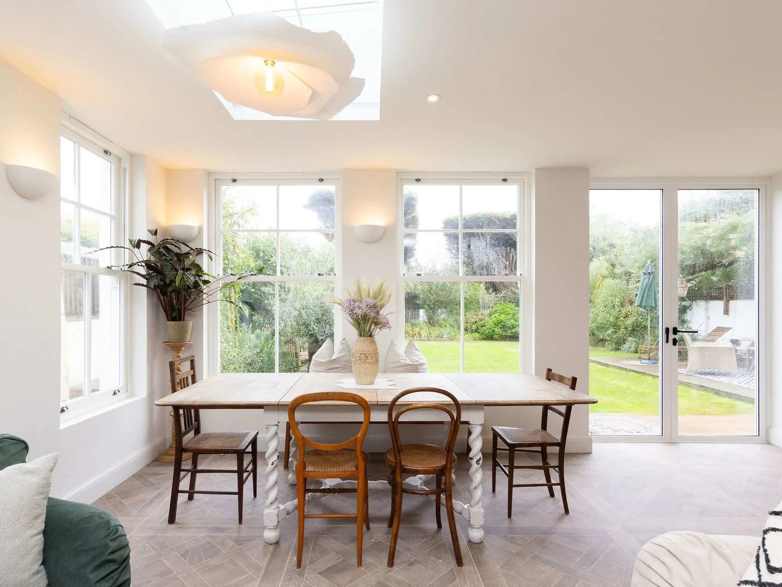Dine with serene views of the garden, bringing the beauty of the outdoors in.