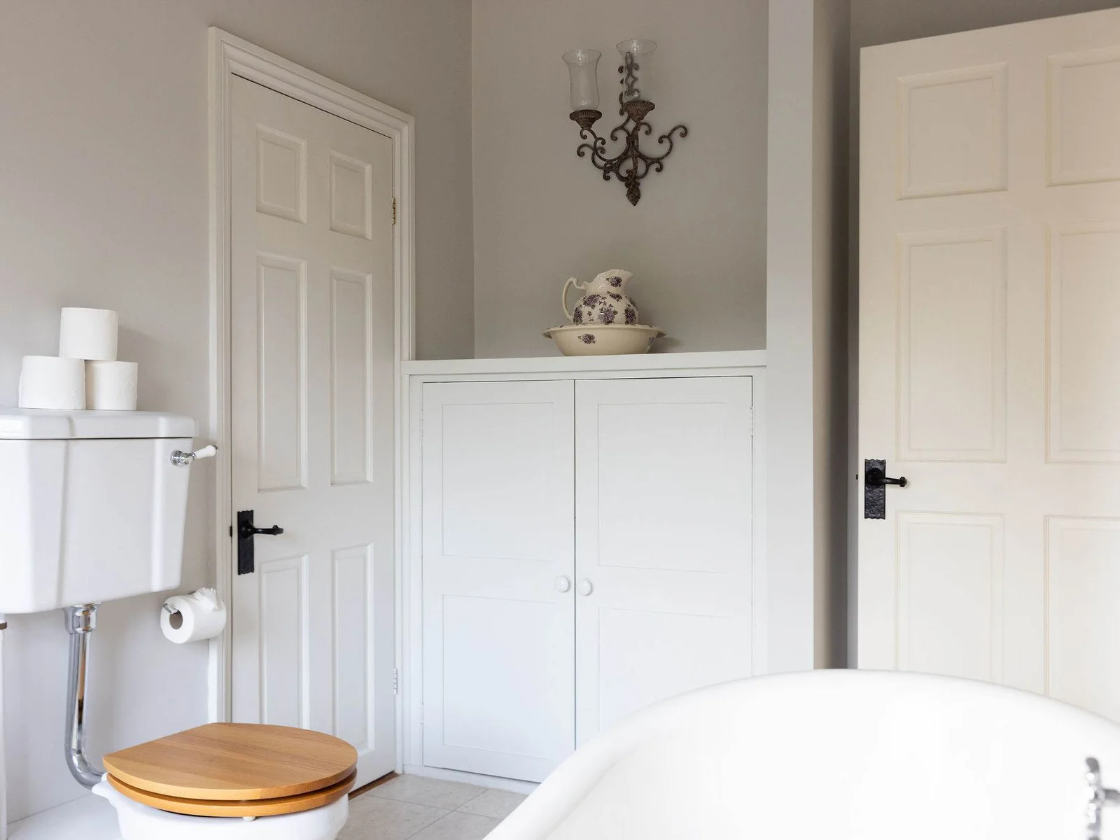 Spacious family bathroom with classic countryside styling.
