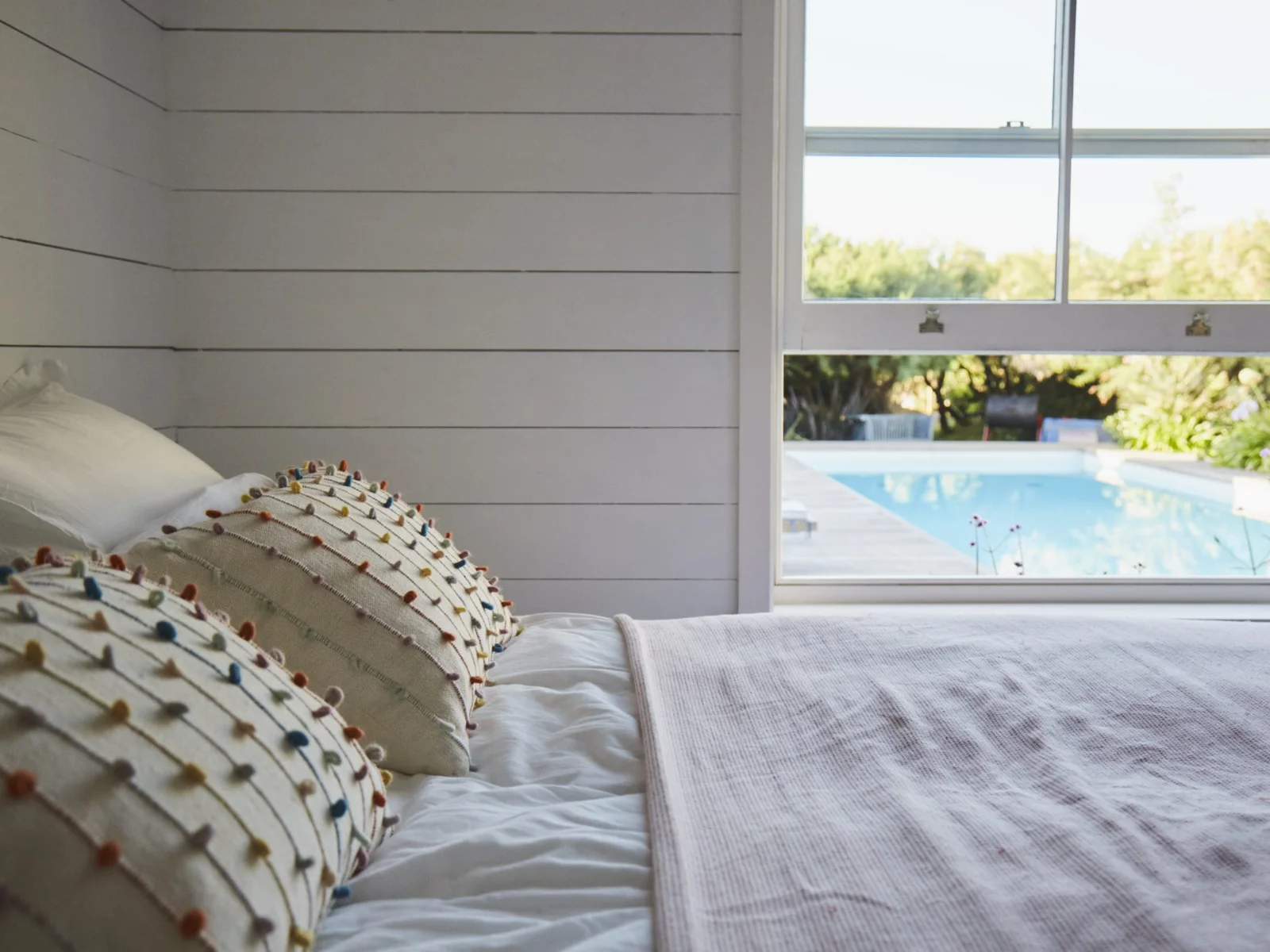Wake up to poolside views in our tranquil and beautifully decorated bedroom