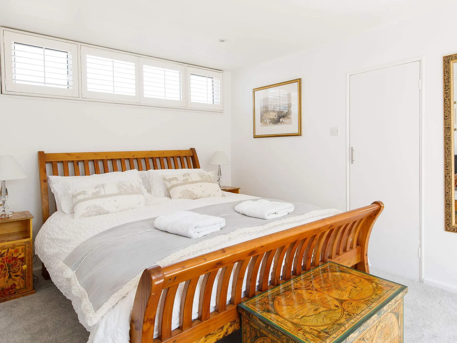 The second king has a comfy sleigh bed with luxurious bedding and linen.