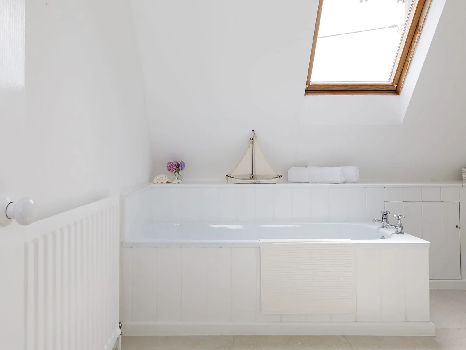 The beautiful family bathroom is spacious and modern.