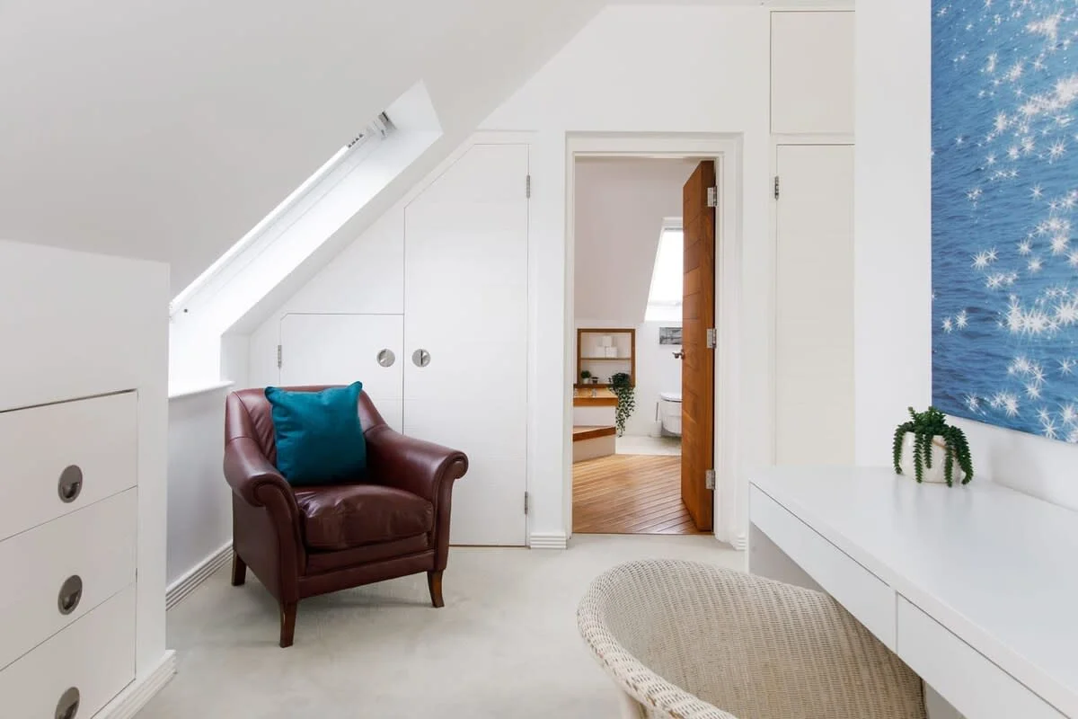 The master room has plenty of cupboard and draw space for your belongings.