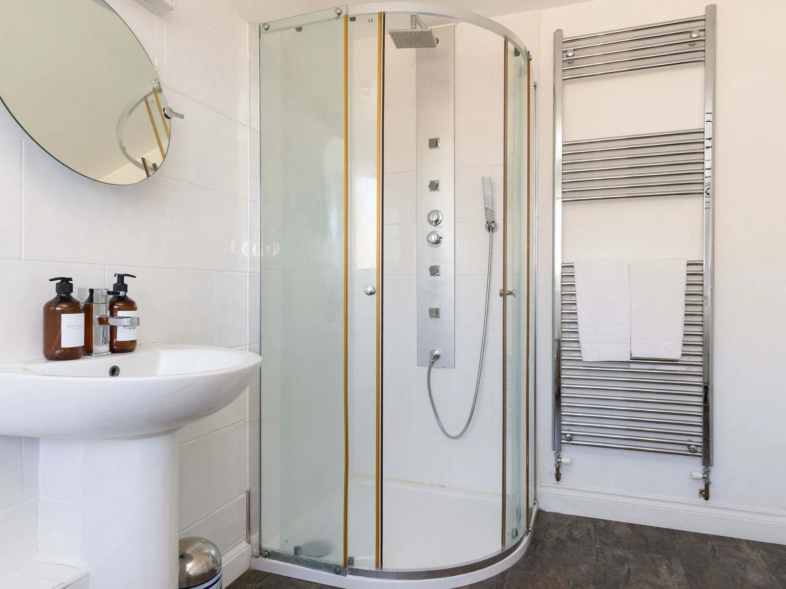 Start your day refreshed using the modern corner shower in this spacious holiday home.