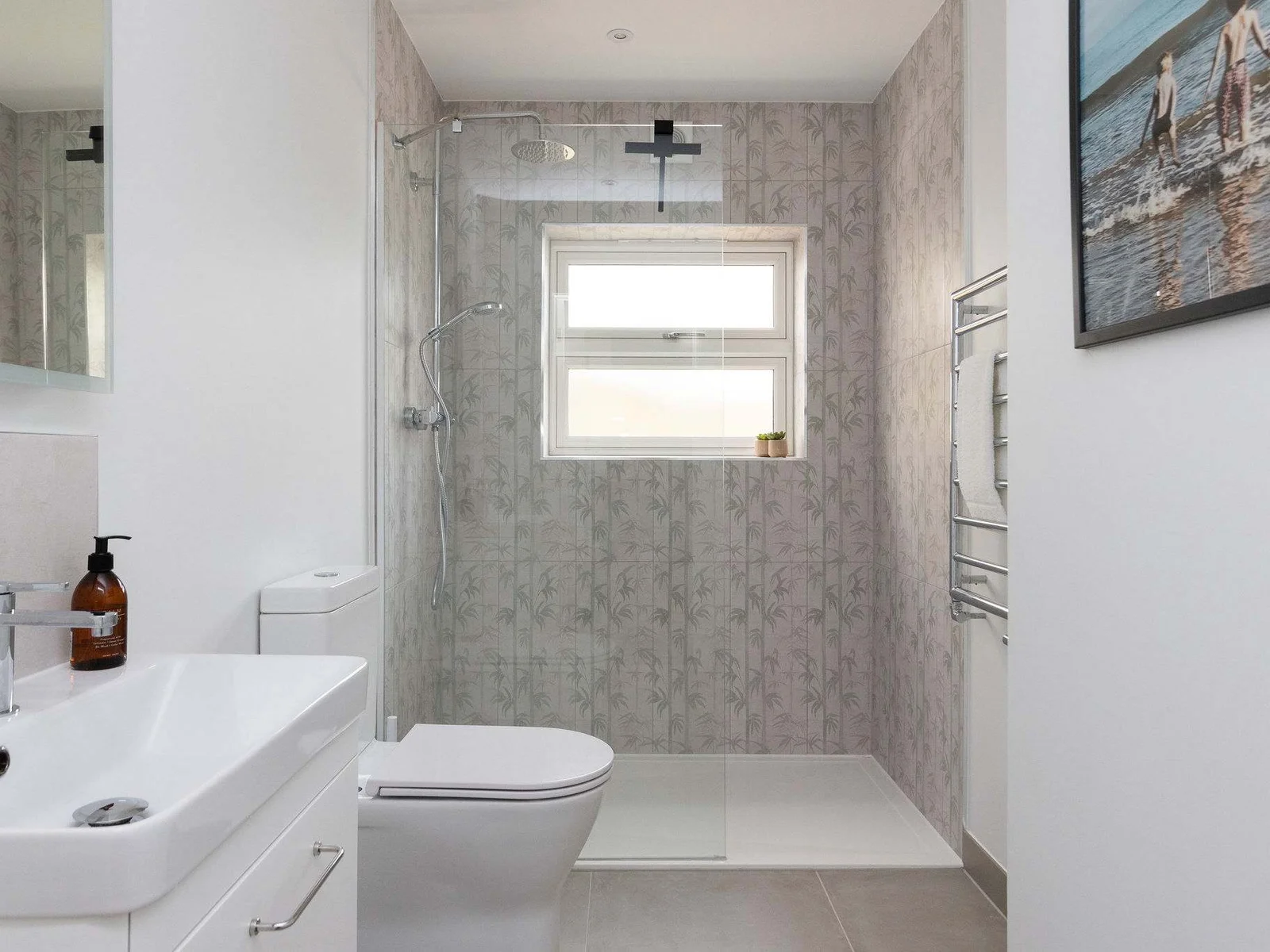 Modern downstairs shower room for rinsing off the sand after a day on the beach!