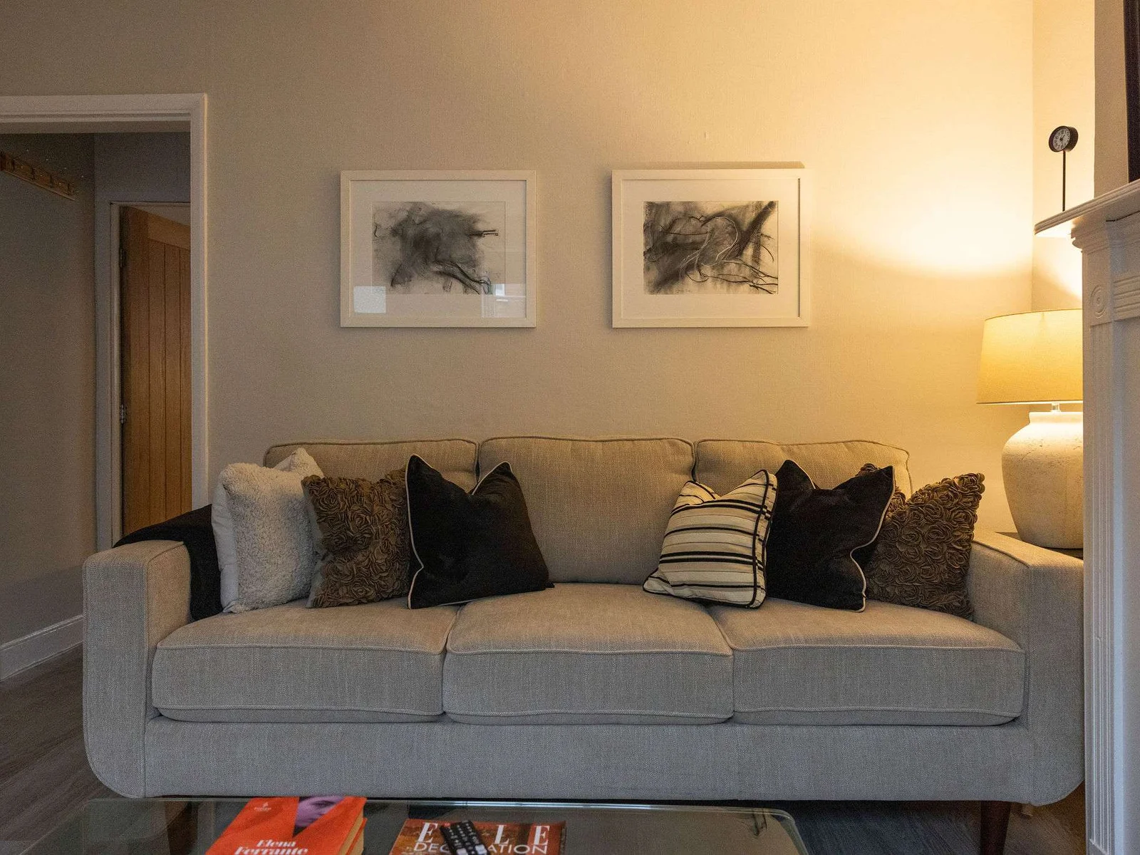 The inviting living area is styled with plush, comfy cushions with soft ambient lamp lighting.