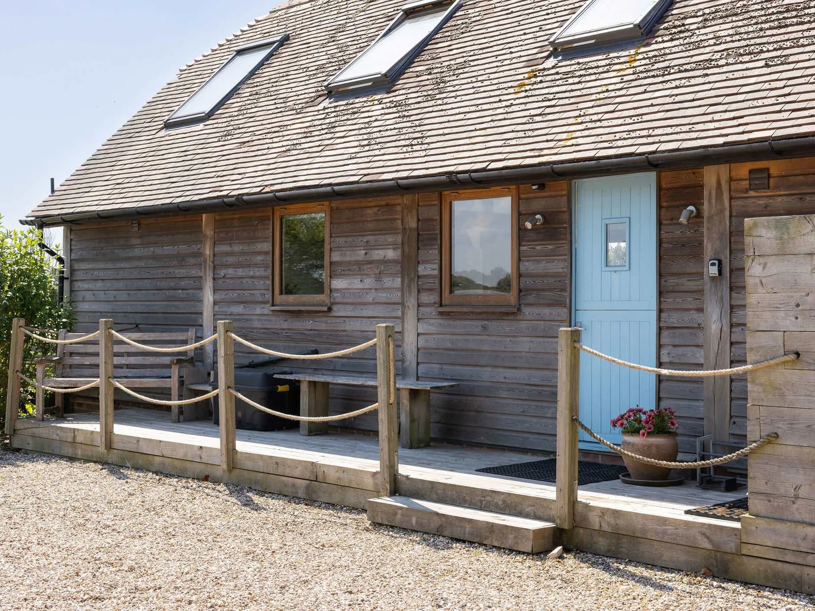 Relax on the deck of this unique West Wittering getaway.