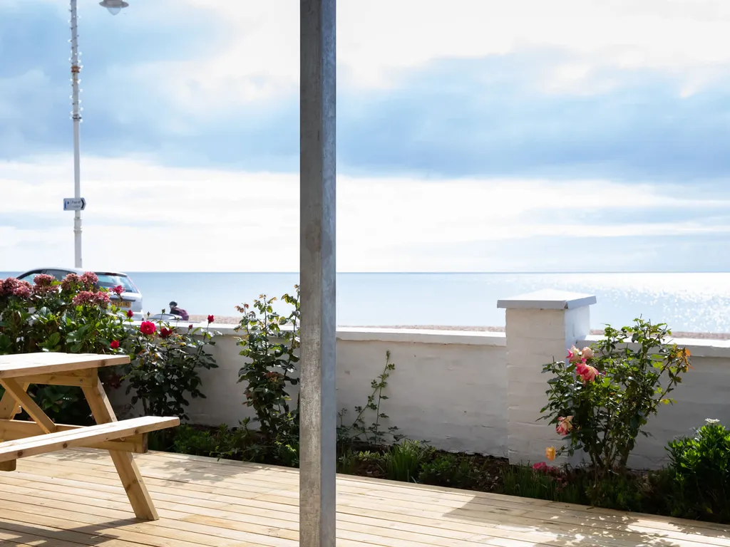 Absolute Beachfront with Decked Garden Oasis and Views