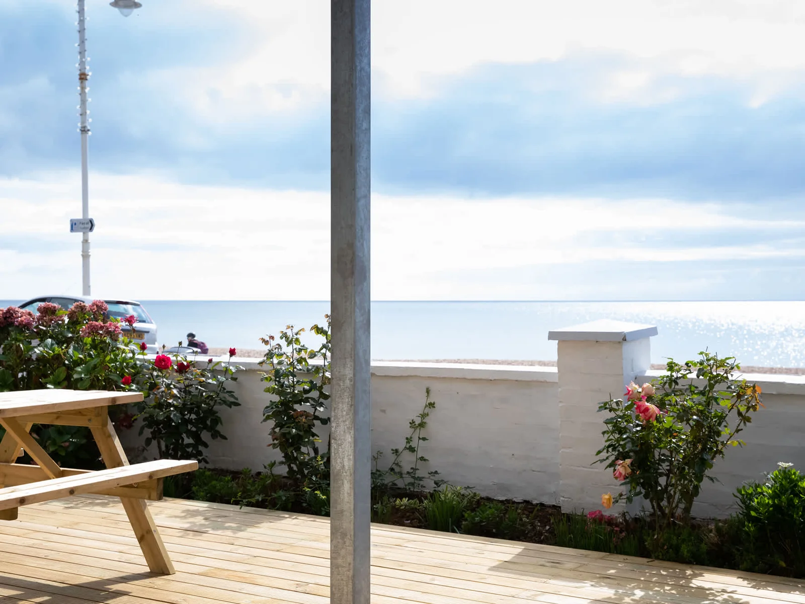 Sit out in the decked garden and take in the glistening ocean with your morning coffee