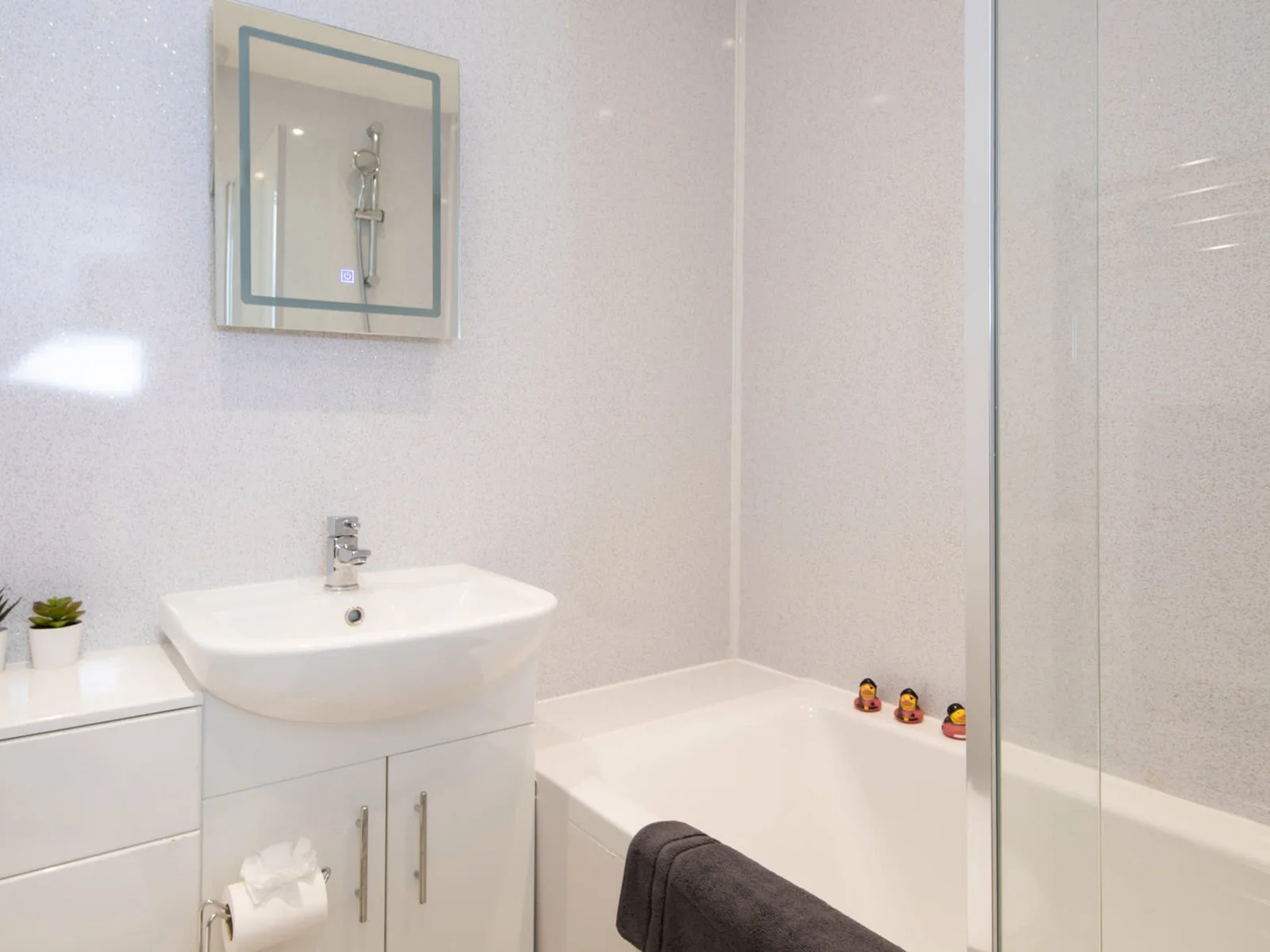 The modern bathroom comes equipped with all the essentials for your stay