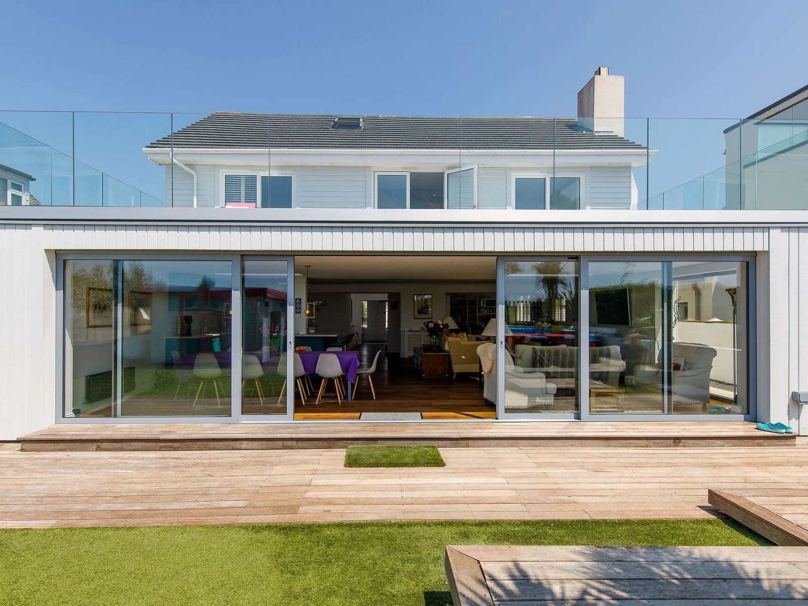 The rear of the home has large sliding patio doors to connect the home to the garden. This huge space is great for entertaining and dining with the whole family.