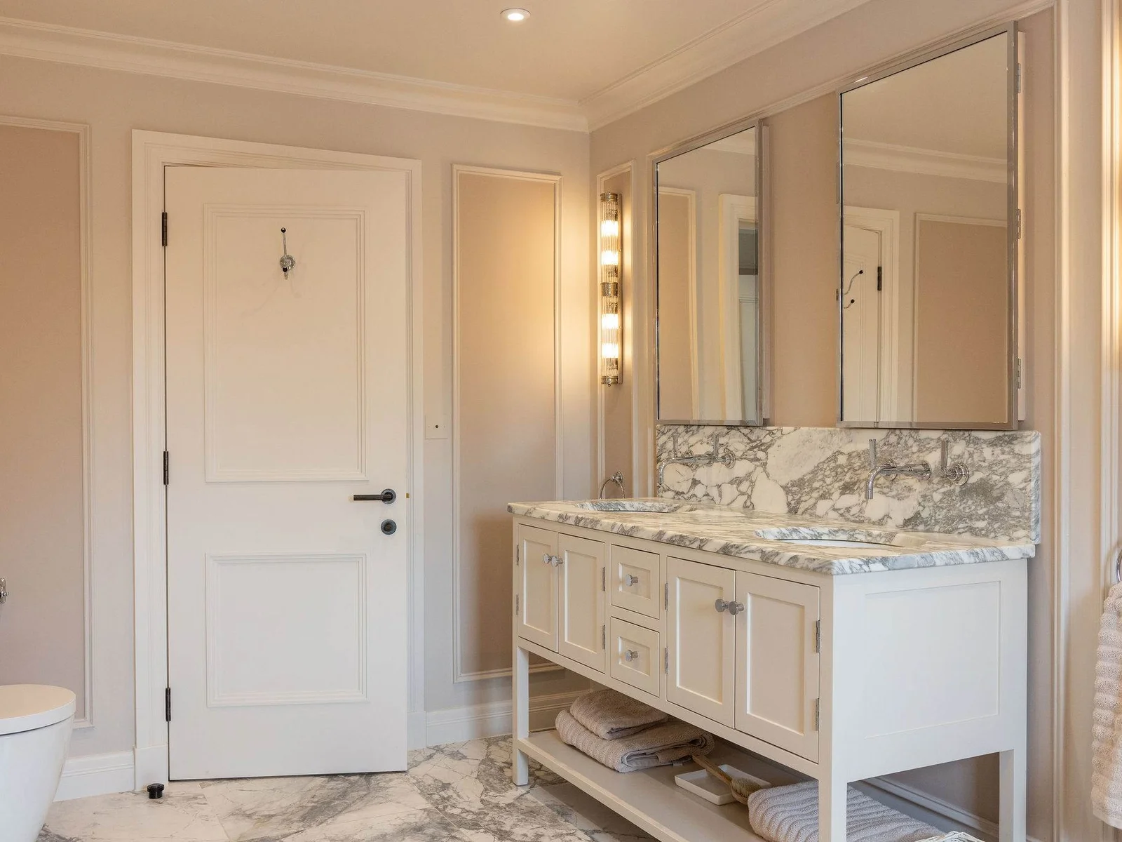 Elegant master bathroom with double marble vanity