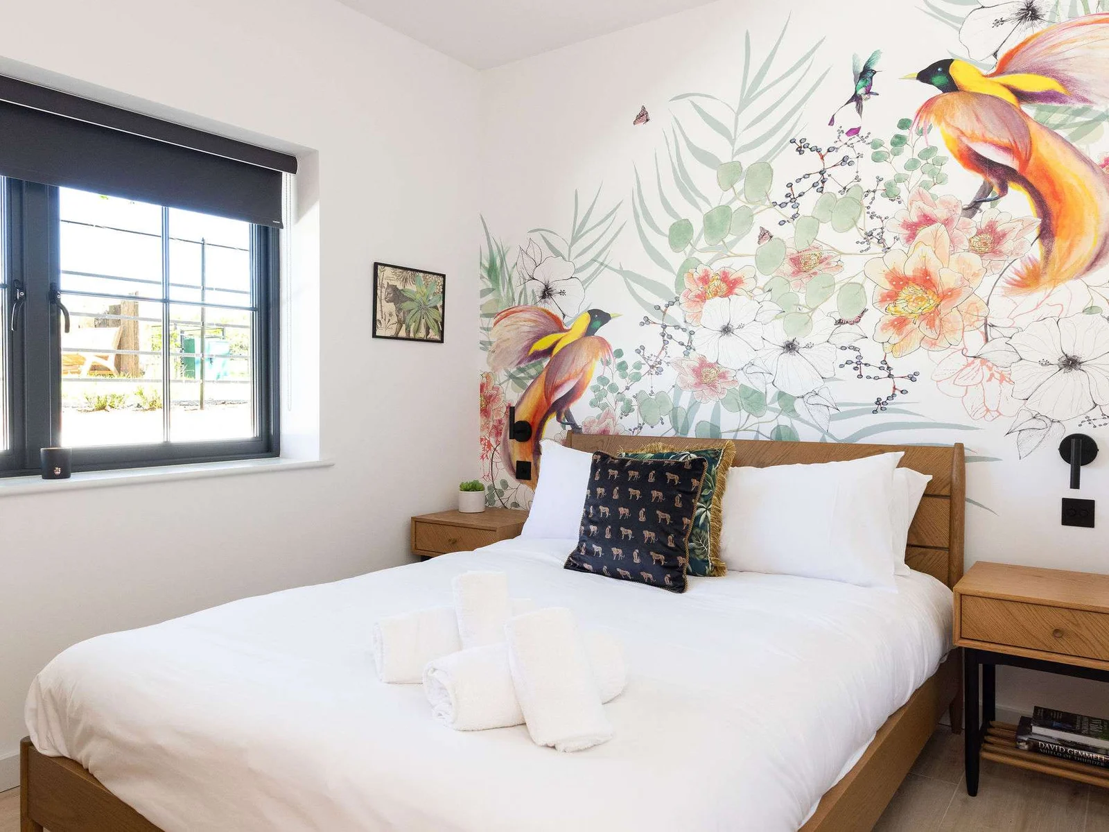 Wake gently in a bright bedroom with soft linens, garden views, and calming nature-inspired decor.