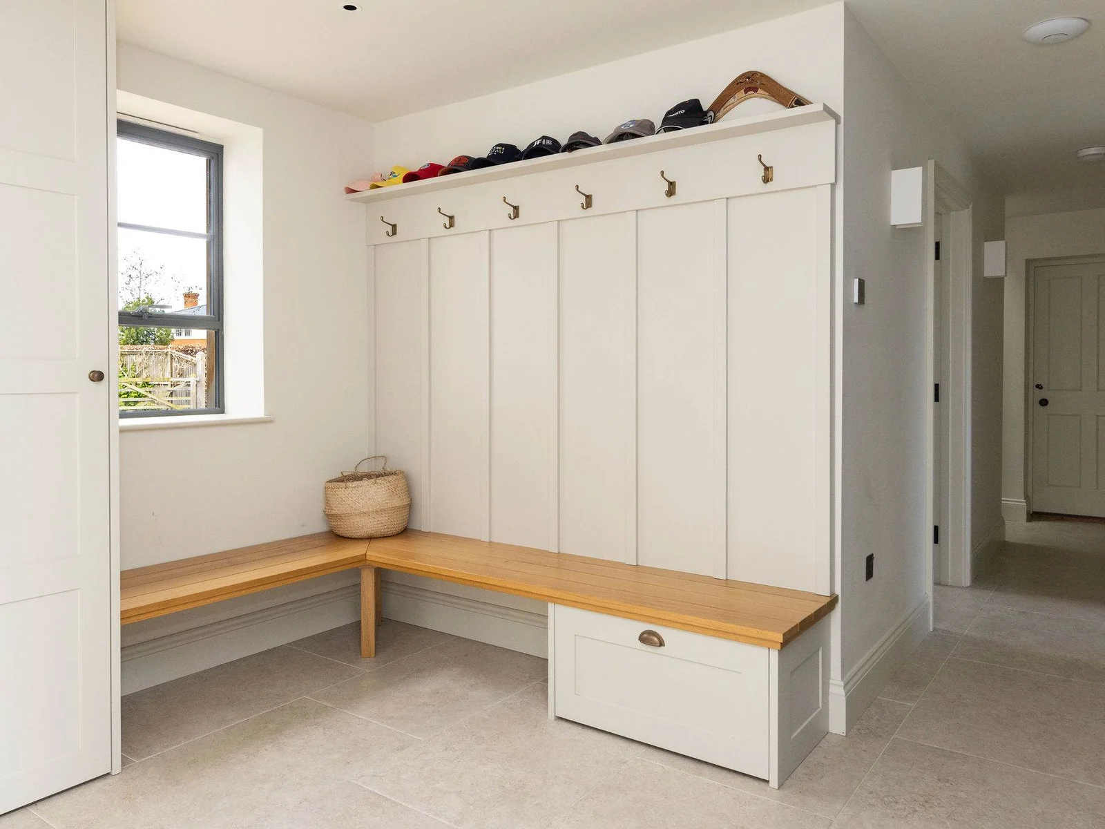 Practical boot room with built-in storage, perfect for stashing coats and shoes after coastal walks.