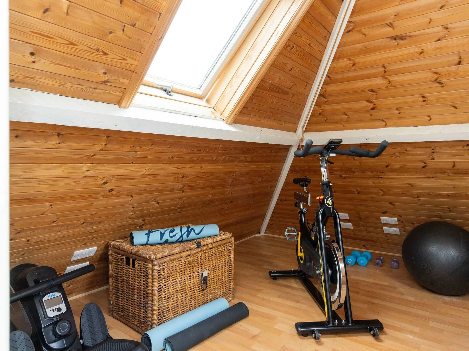 Keep-fit area with rowing machine and exercise bike