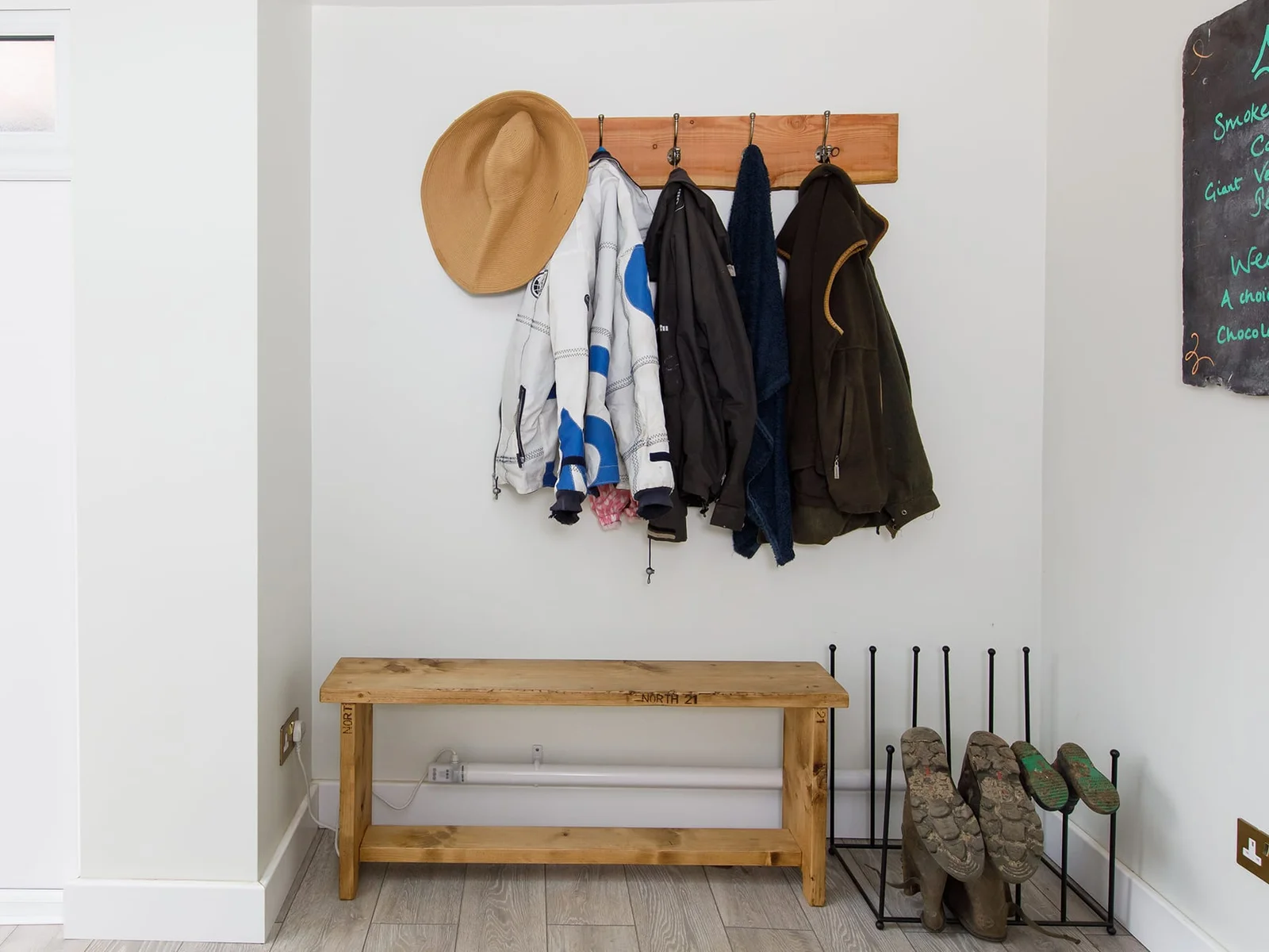 The entrance hall has plenty of space for shoes, boots and coats.